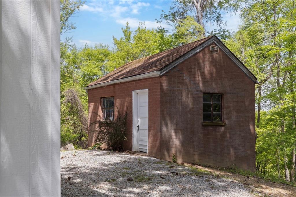3566 Green Garden Road Aliquippa, PA 15001 - Photo 49 of 50 a backyard of a house with potted plants