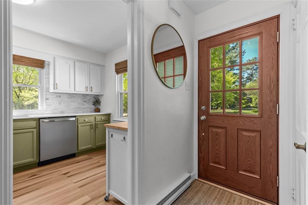 3566 Green Garden Road Aliquippa, PA 15001 - Photo 5 of 50 a kitchen with granite countertop a stove a sink and a window