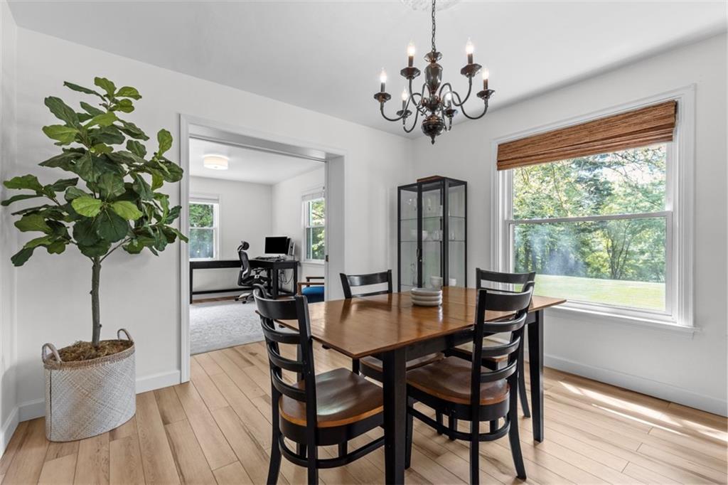 3566 Green Garden Road Aliquippa, PA 15001 - Photo 10 of 50 a dining room with furniture potted plants and wooden floor