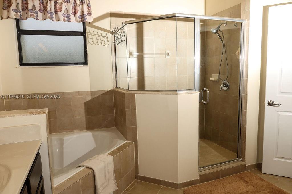 11601 Southwest 232nd Lane Homestead, FL 33032 - Photo 11 of 32 a bathroom with a shower and a sink