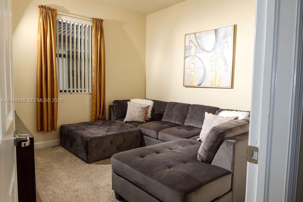 11601 Southwest 232nd Lane Homestead, FL 33032 - Photo 16 of 32 a living room with furniture and a window