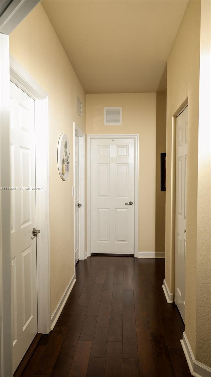 11601 Southwest 232nd Lane Homestead, FL 33032 - Photo 24 of 32 a view of a hallway with wooden floor