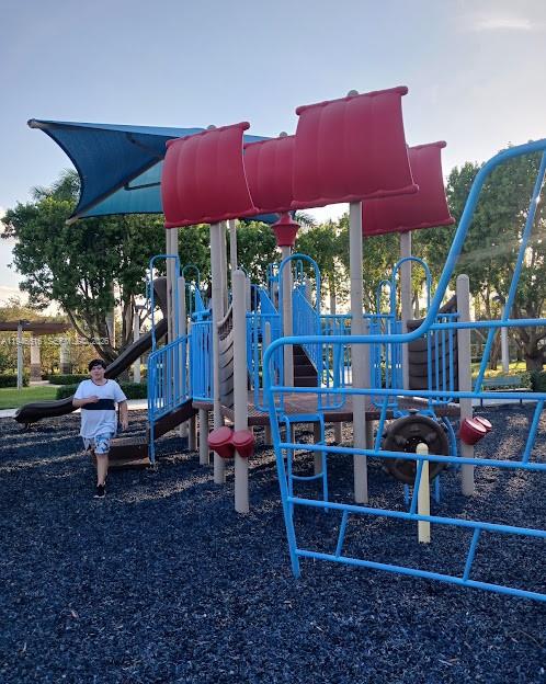 11601 Southwest 232nd Lane Homestead, FL 33032 - Photo 31 of 32 a view of a chairs and table in backyard