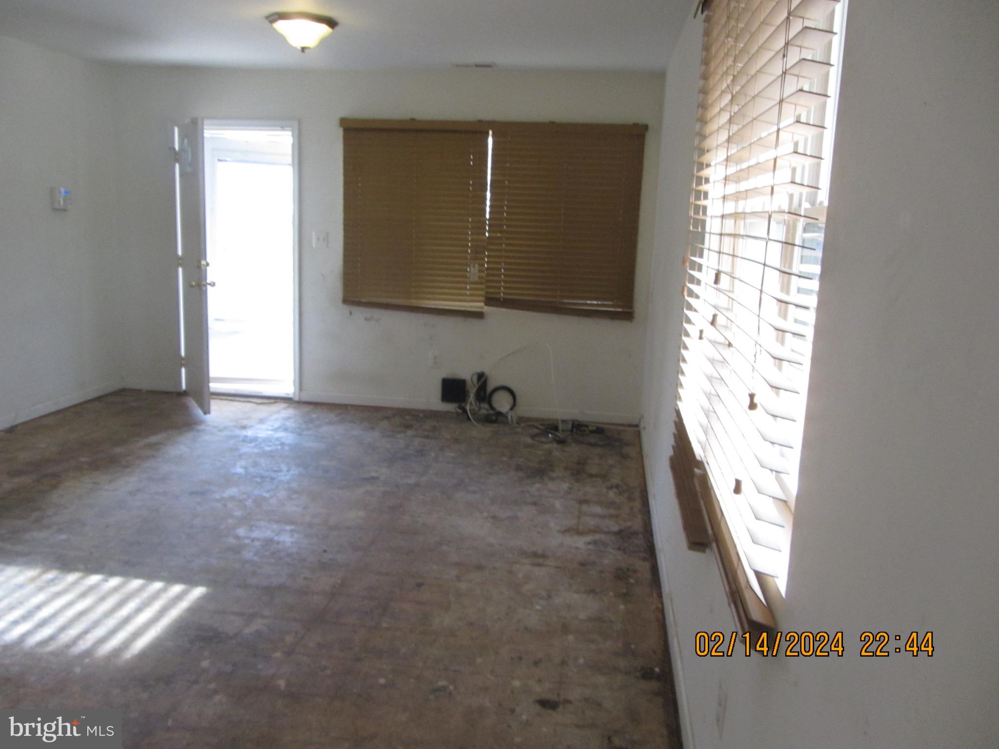7801 Greenleaf Road Hyattsville, MD 20785 - Photo 19 of 51 a view of an empty room with a window