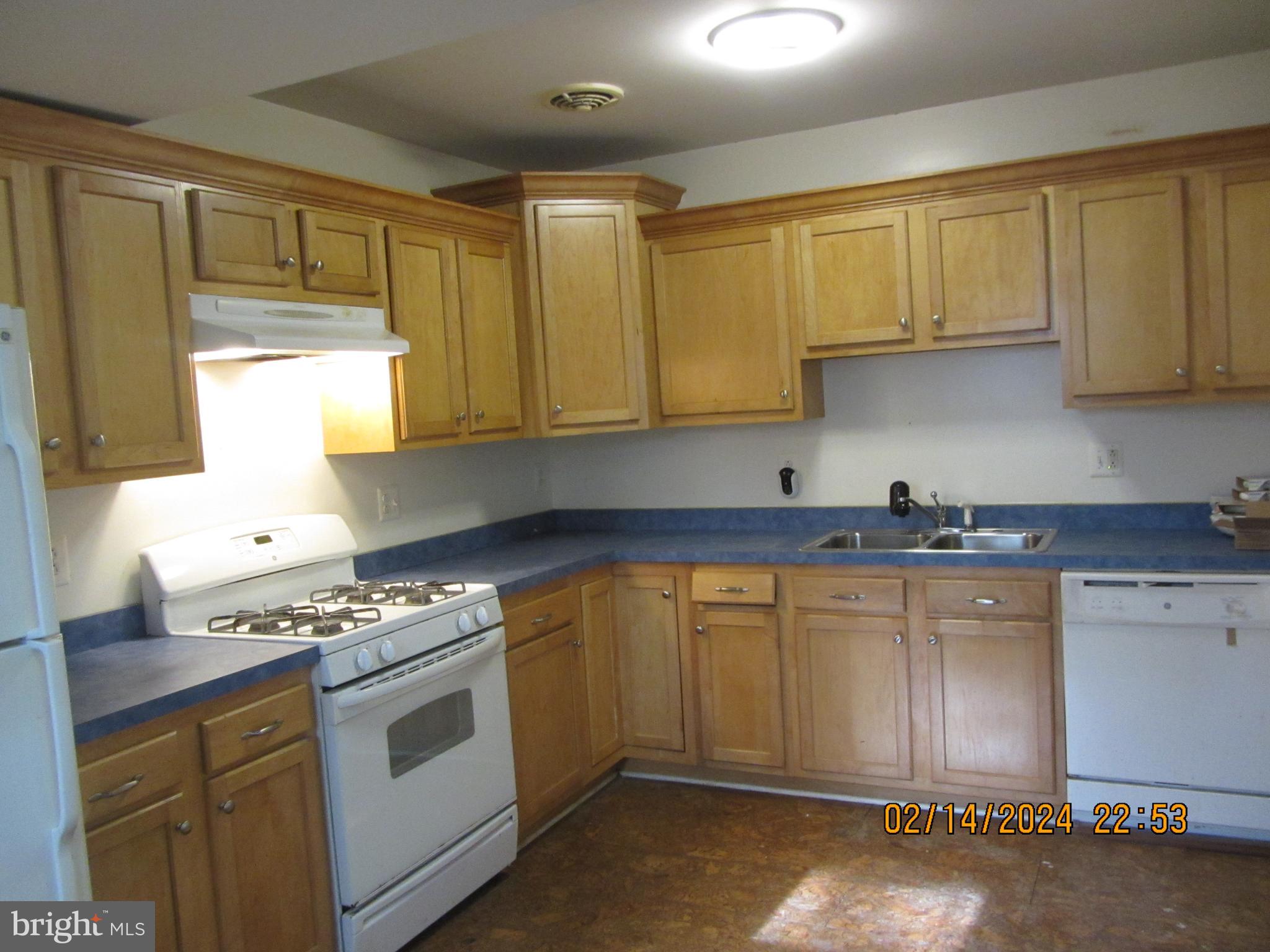7801 Greenleaf Road Hyattsville, MD 20785 - Photo 2 of 51 a kitchen with stainless steel appliances granite countertop a sink stove and cabinets