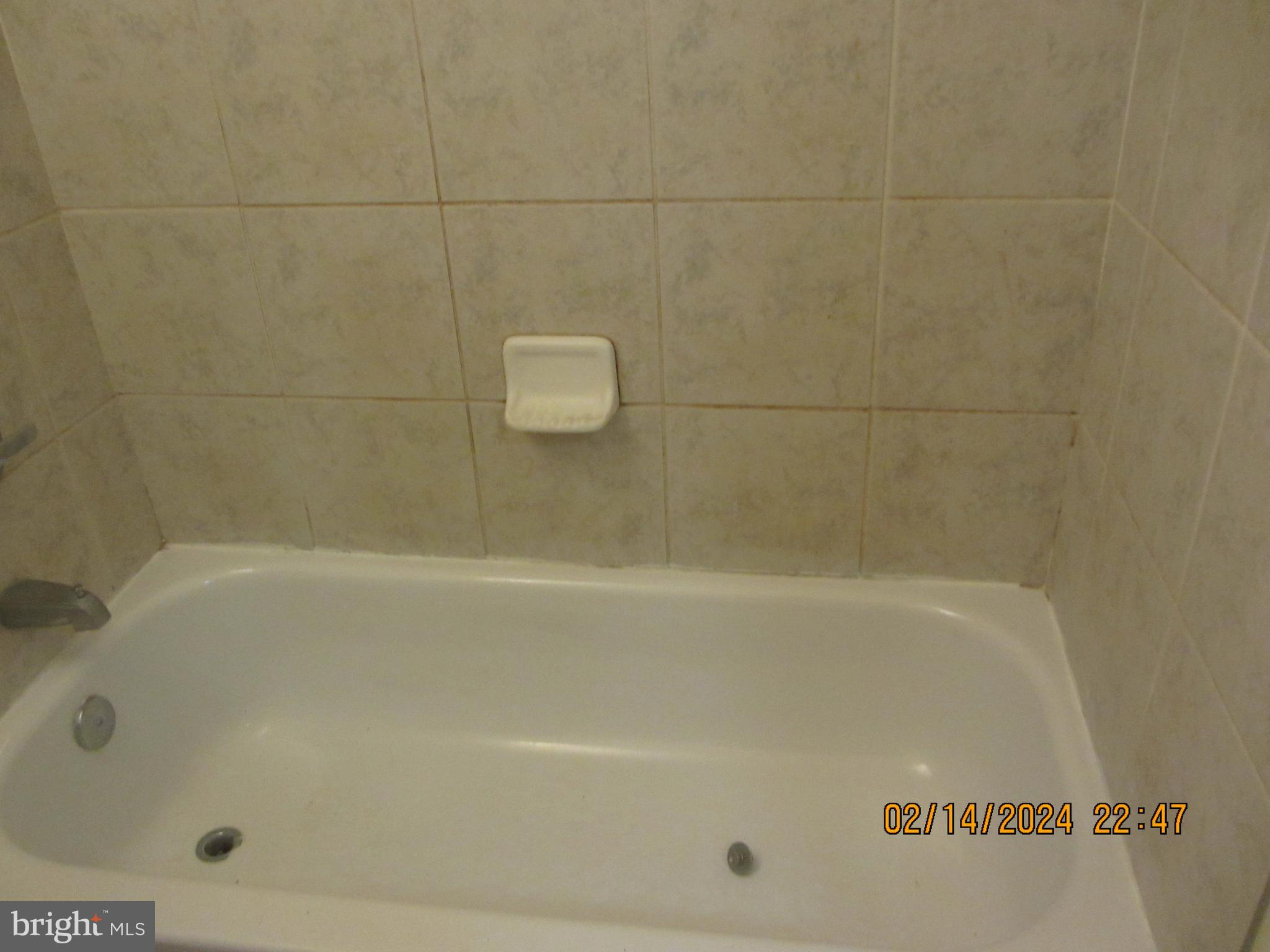 7801 Greenleaf Road Hyattsville, MD 20785 - Photo 28 of 51 a close up of a bathtub in a bathroom
