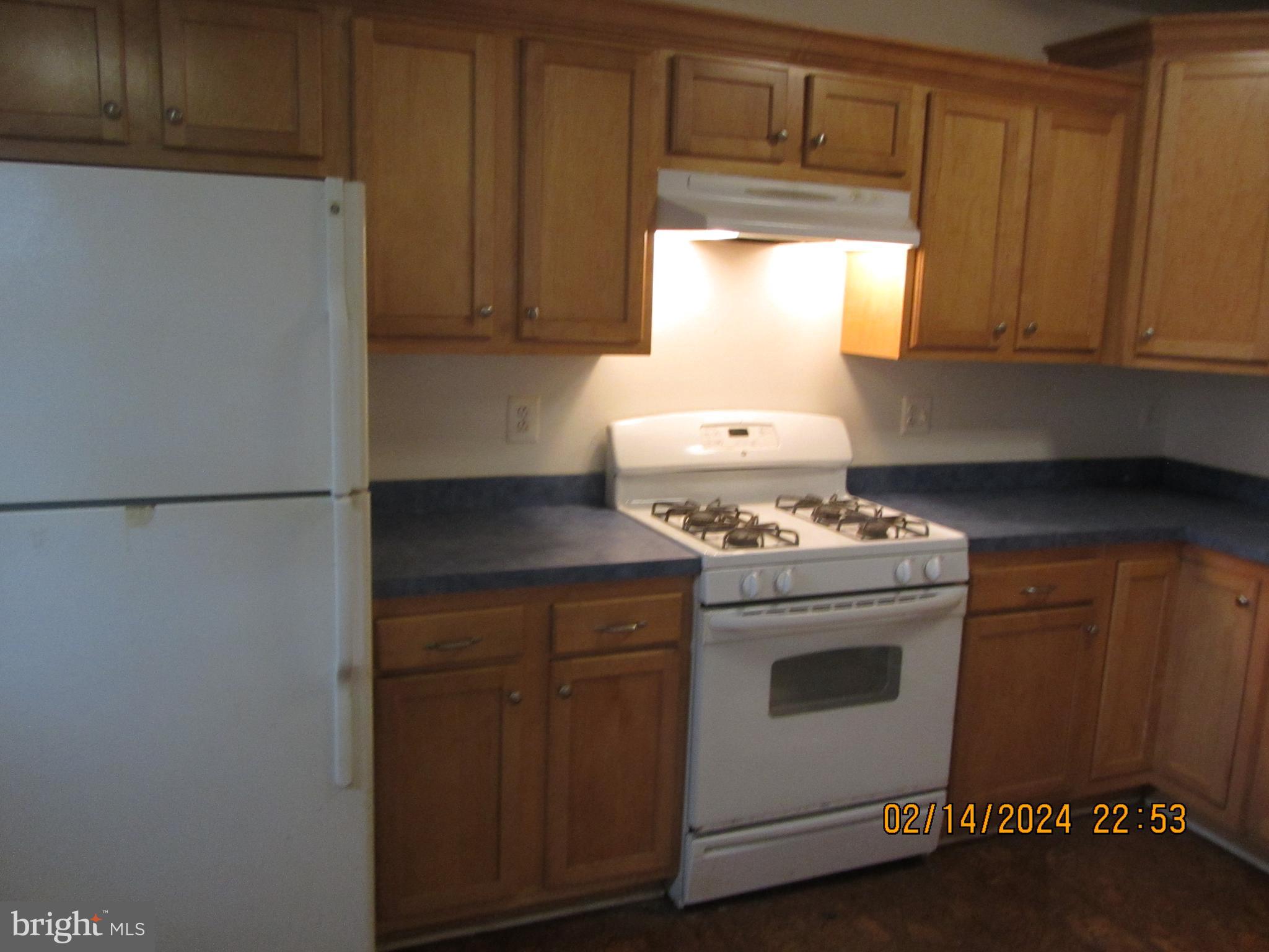 7801 Greenleaf Road Hyattsville, MD 20785 - Photo 3 of 51 a stove top oven sitting inside of a kitchen