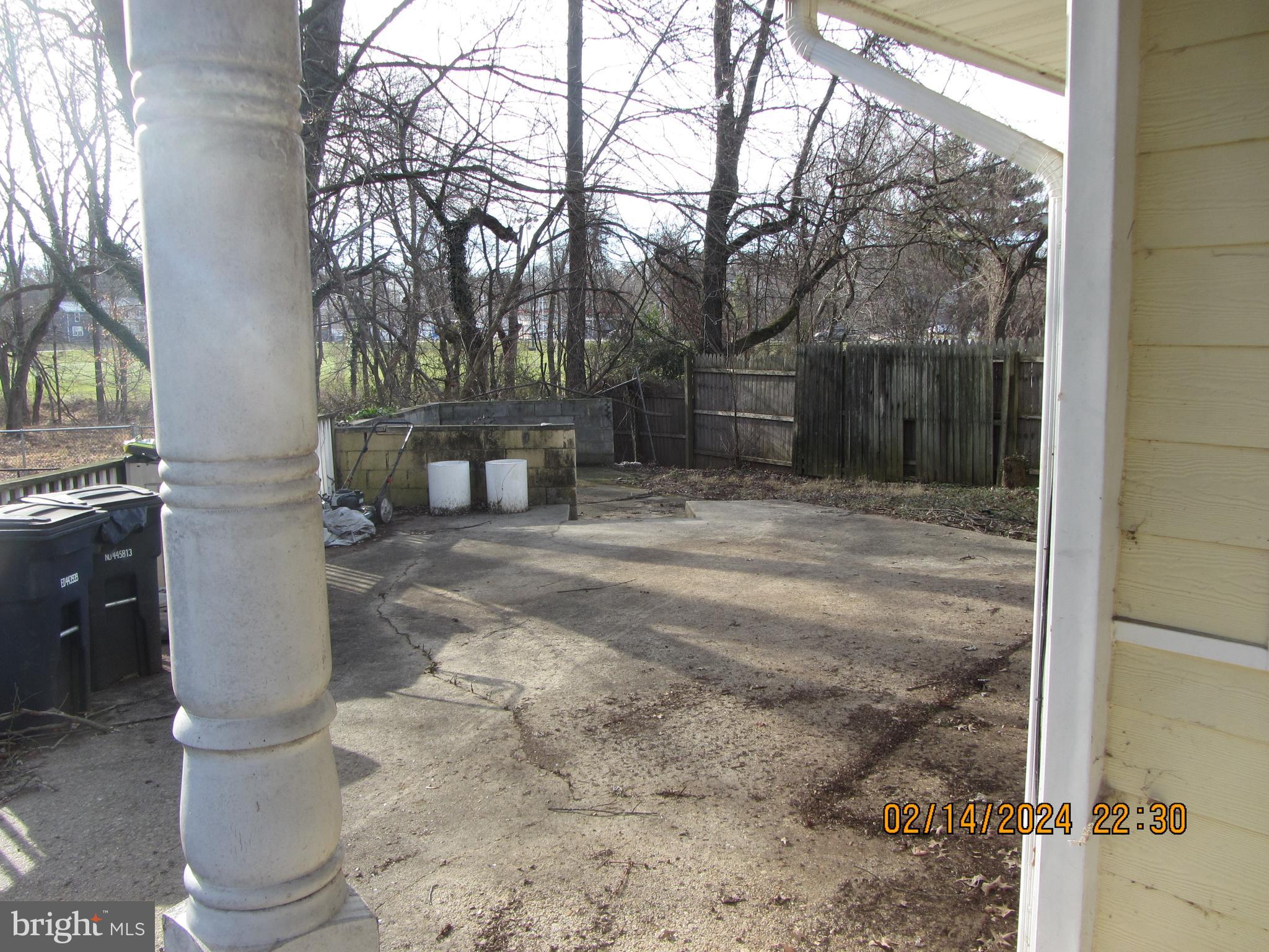 7801 Greenleaf Road Hyattsville, MD 20785 - Photo 10 of 51 a backyard of a house with large trees and outdoor seating