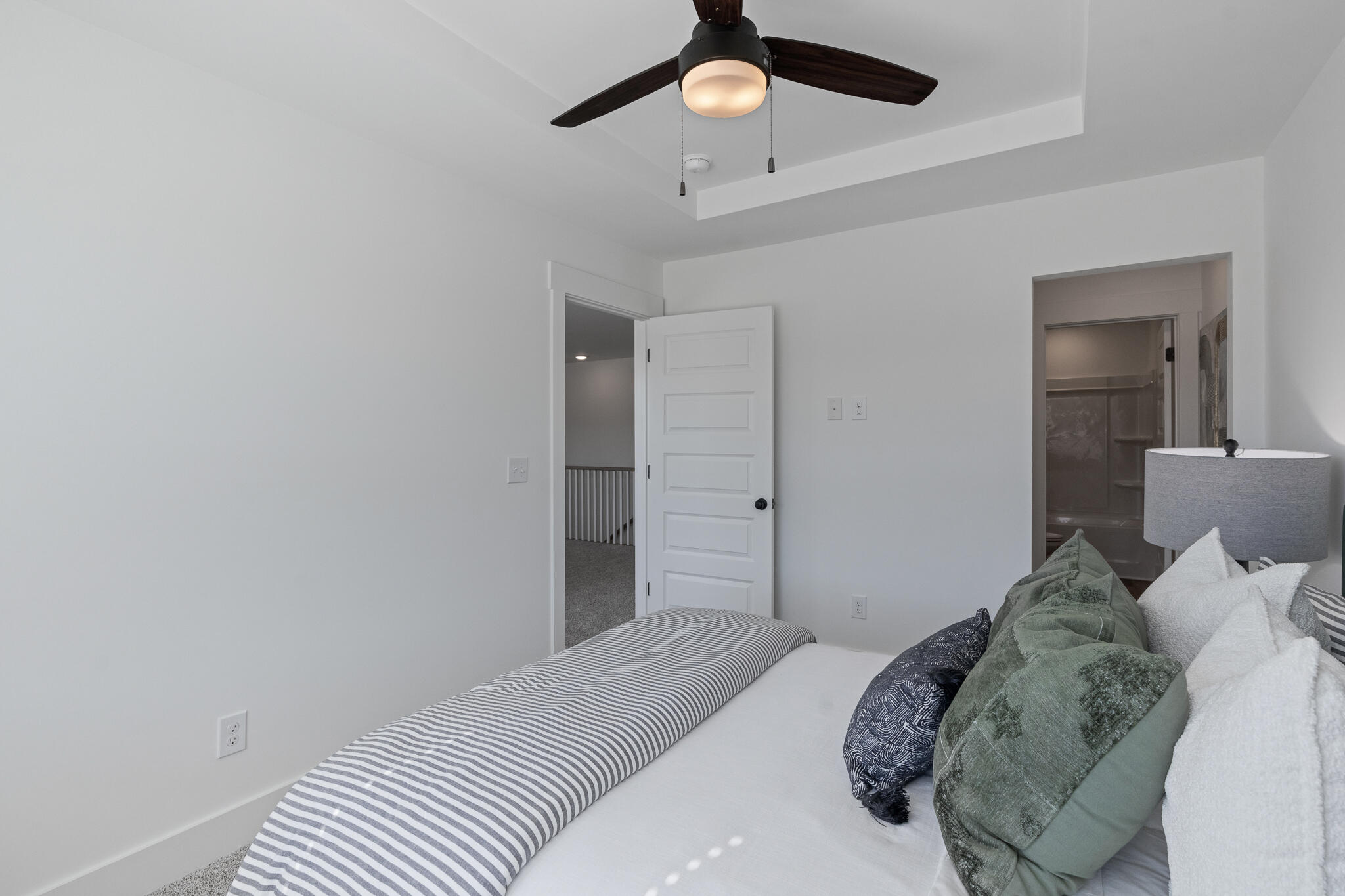 579 Bluebeech Street Freeport, FL 32439 - Photo 25 of 31 a bedroom with a bed and a chandelier