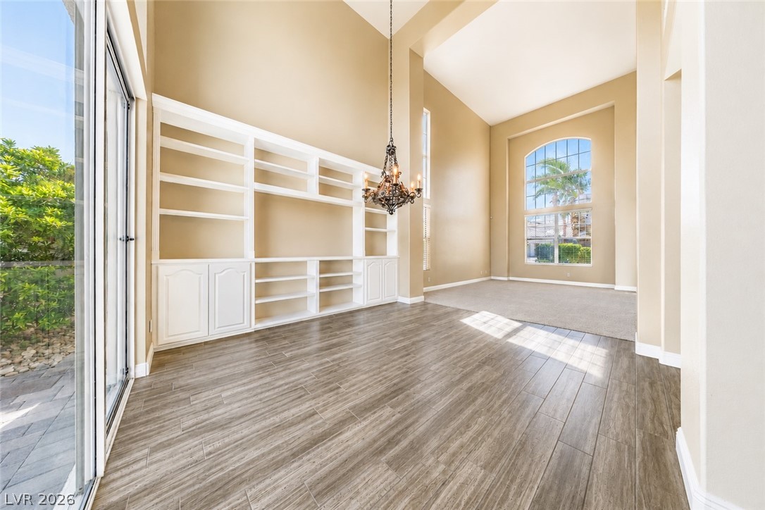 2504 Putting Green Drive Henderson, NV 89074 - Photo 10 of 56 This airy living space features soaring ceilings and built-in shelving, perfect for curated displays.