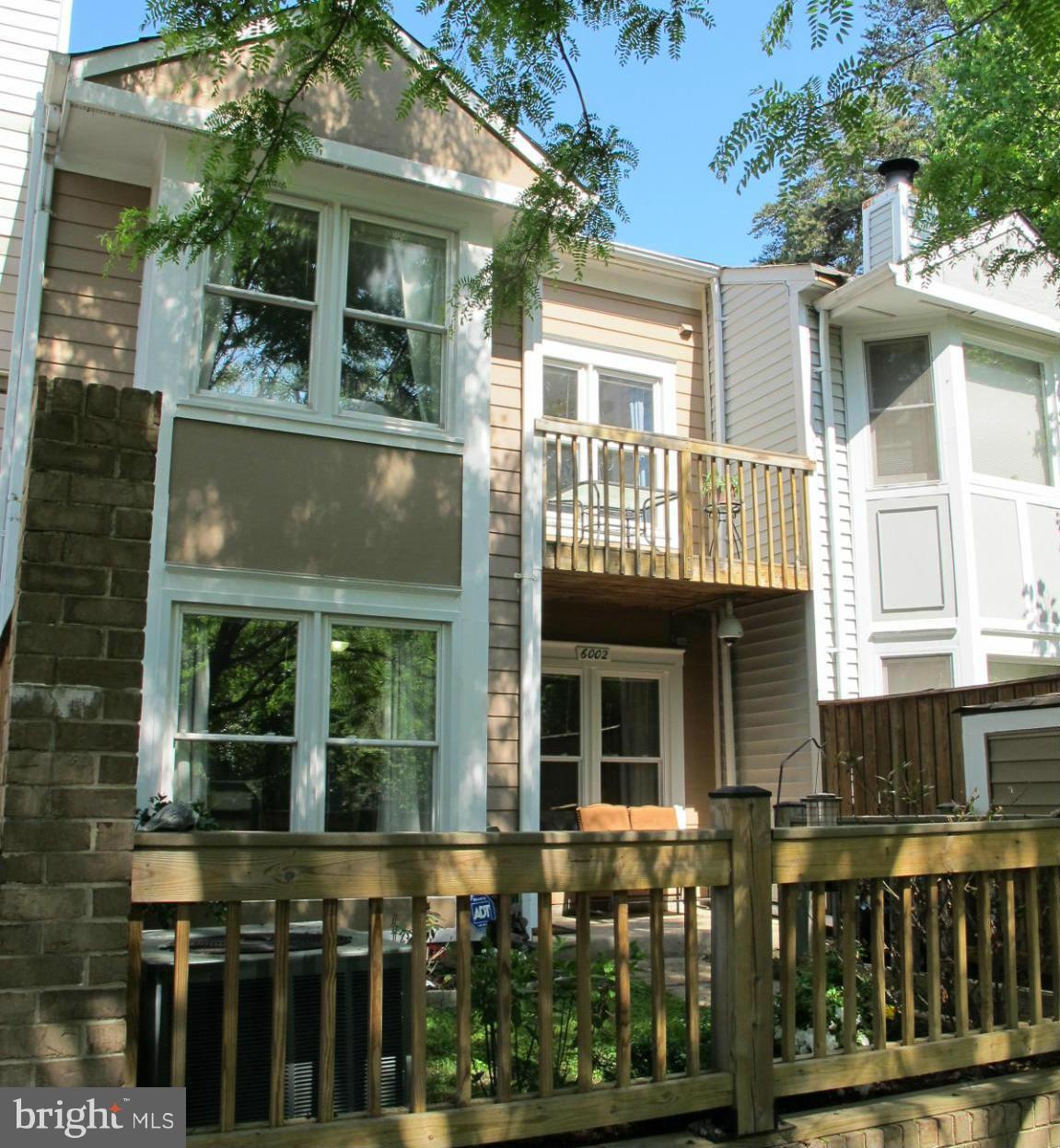 6002 Rabbit Hill Court Centreville, VA 20121 - Photo 2 of 29 a front view of a building with a garden