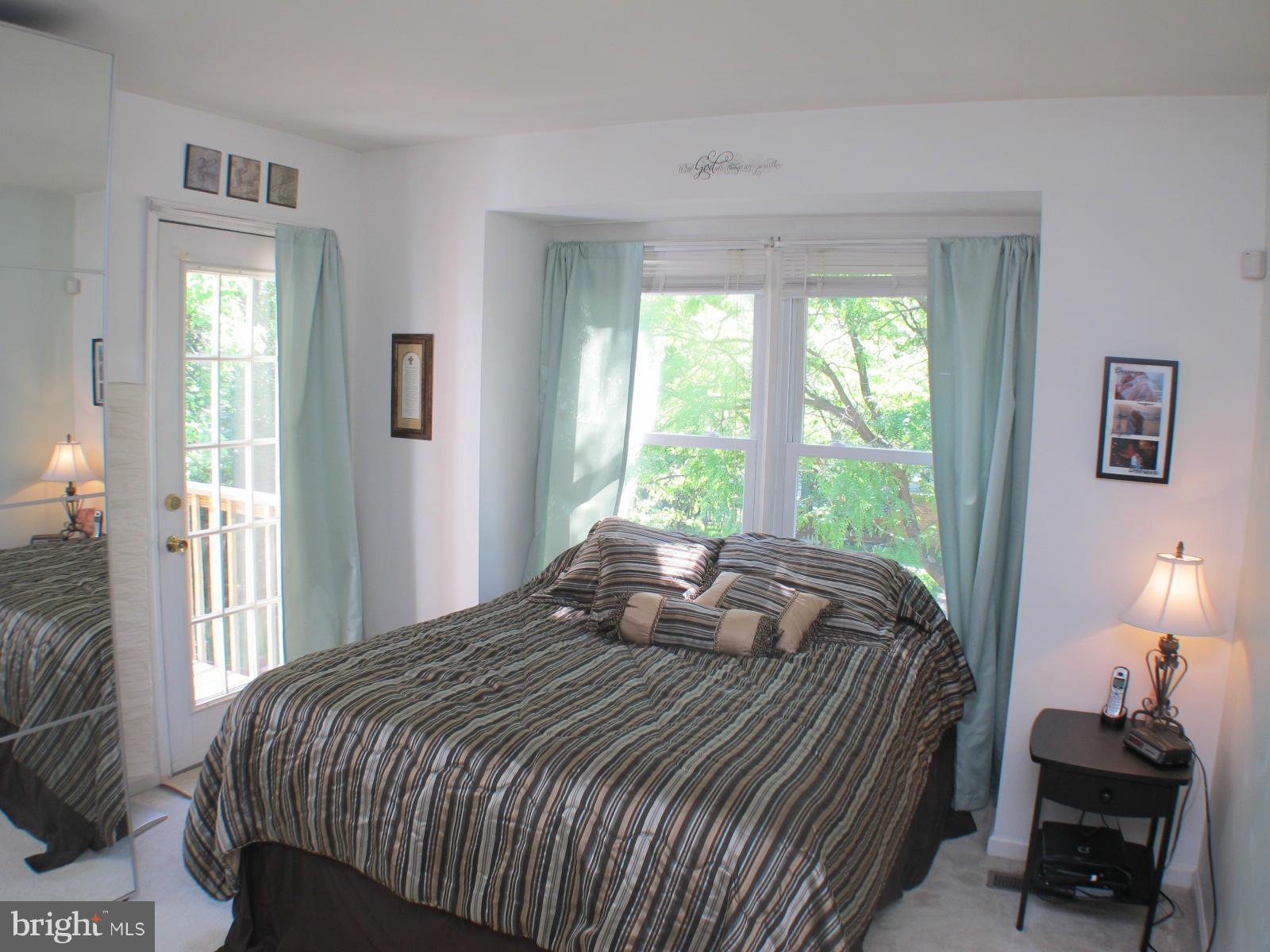 6002 Rabbit Hill Court Centreville, VA 20121 - Photo 20 of 29 a bedroom with a bed and a window