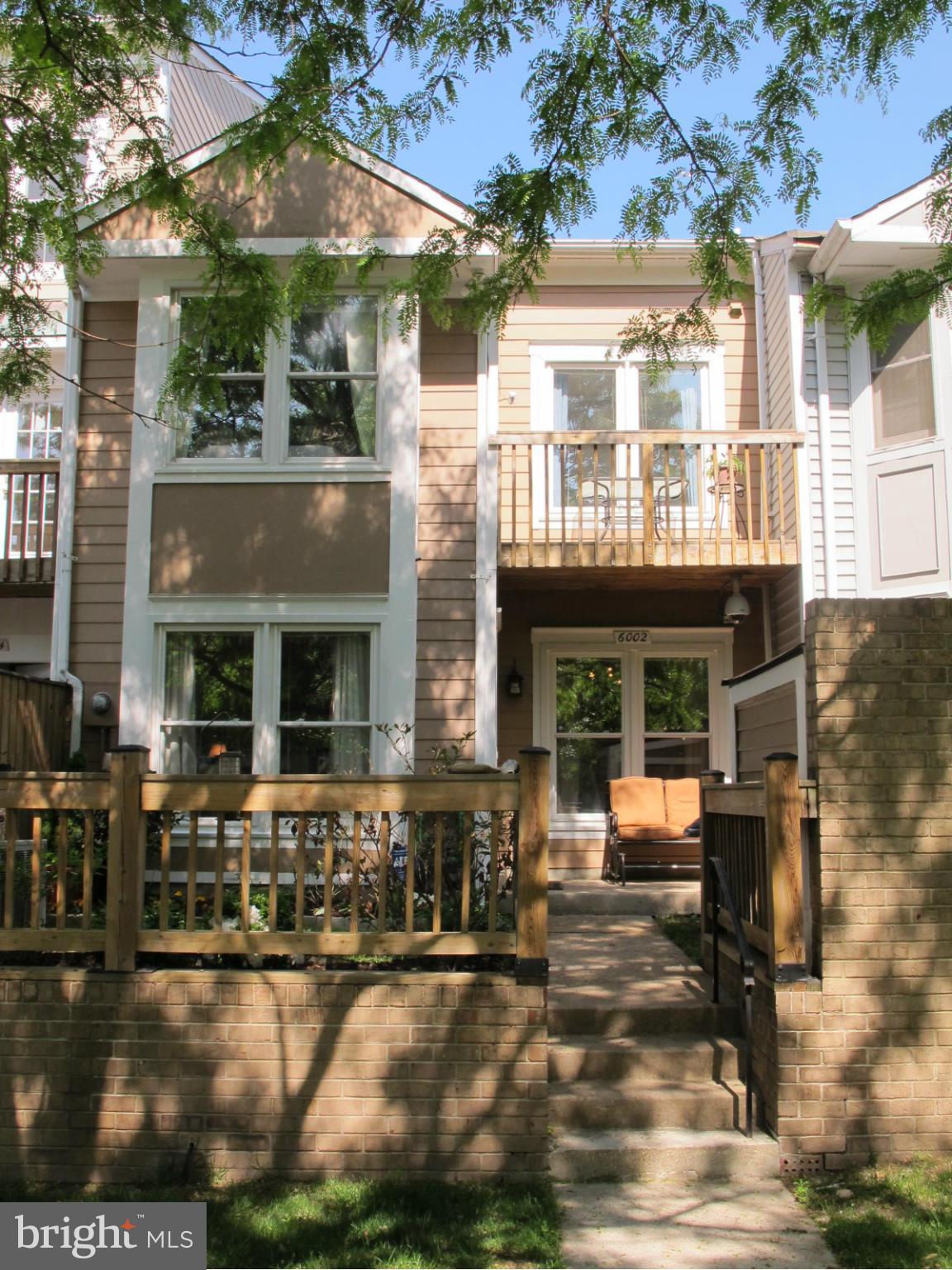 6002 Rabbit Hill Court Centreville, VA 20121 - Photo 25 of 29 a front view of a building with outdoor seating