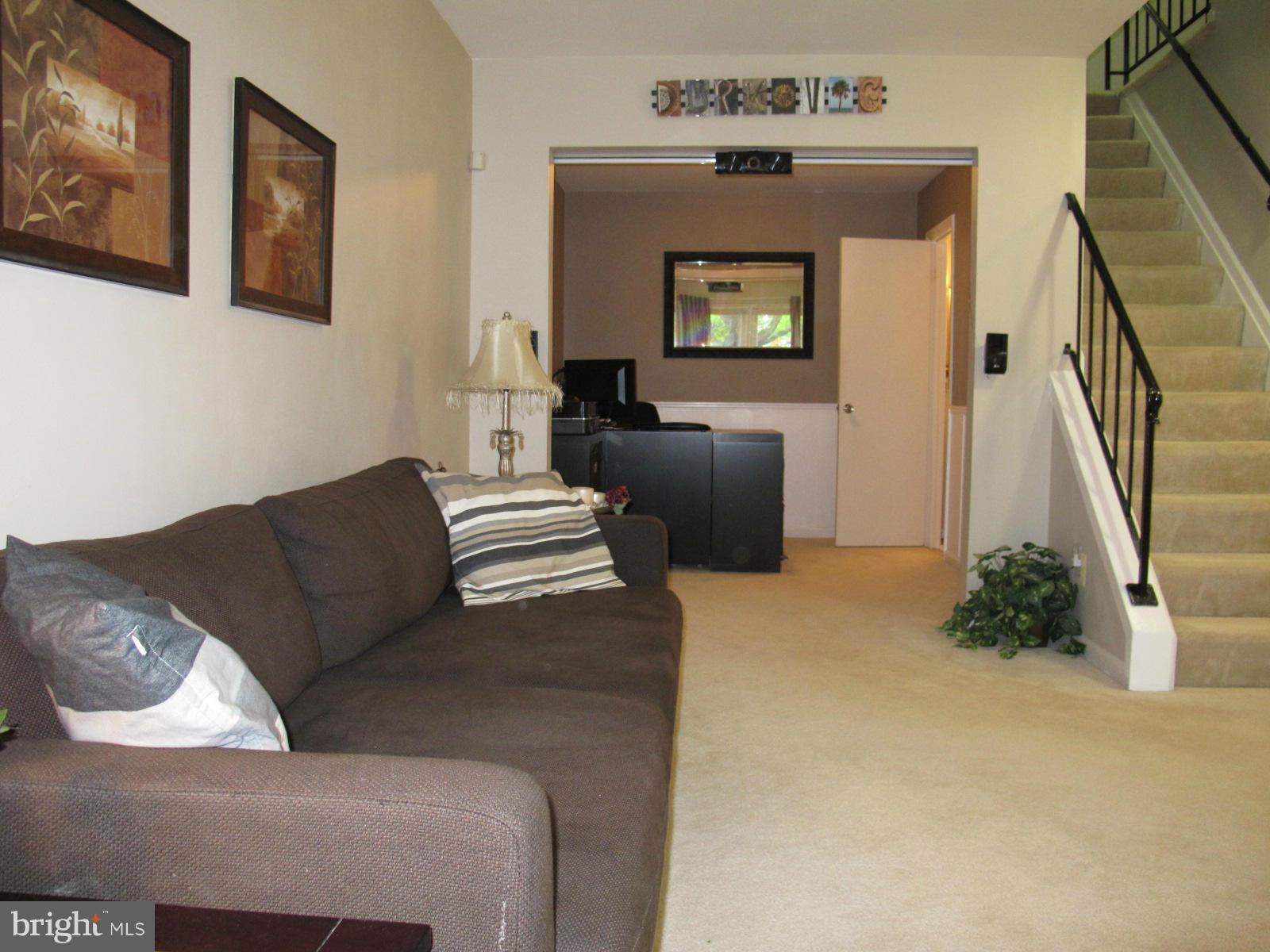6002 Rabbit Hill Court Centreville, VA 20121 - Photo 6 of 29 a living room with furniture and a fireplace