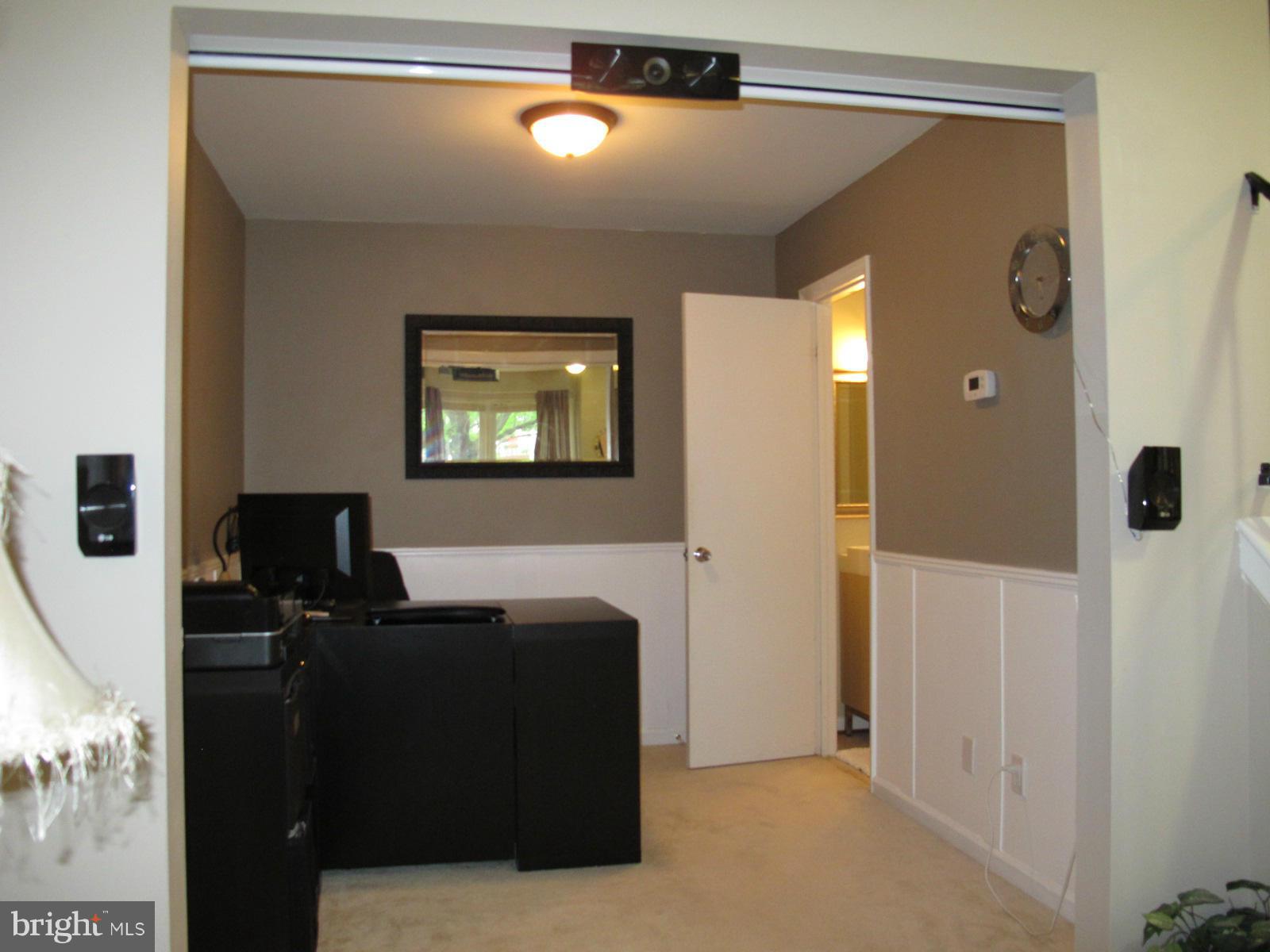 6002 Rabbit Hill Court Centreville, VA 20121 - Photo 7 of 29 a living room with a couch and a chandelier