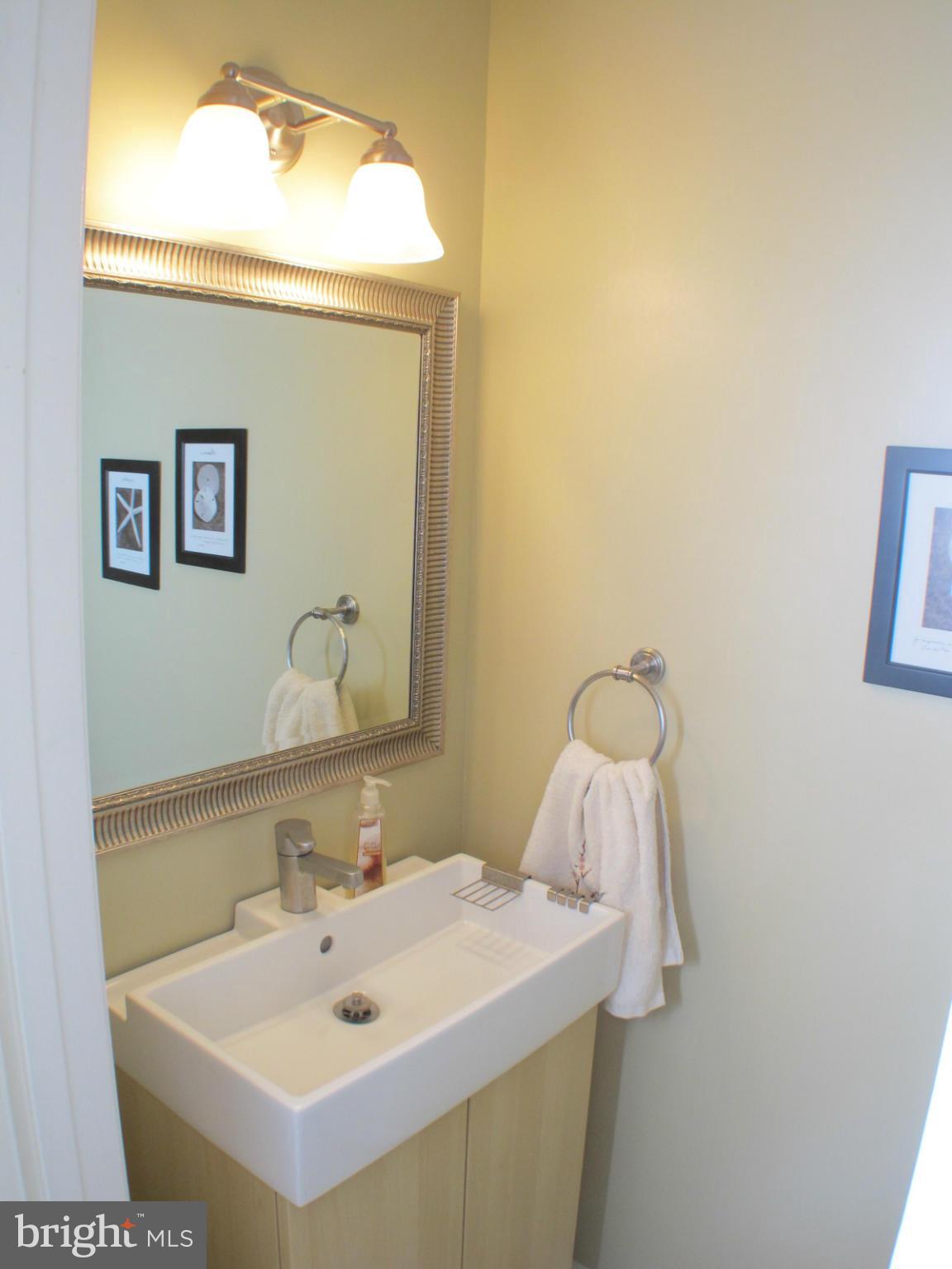 6002 Rabbit Hill Court Centreville, VA 20121 - Photo 9 of 29 a bathroom with a sink and a mirror