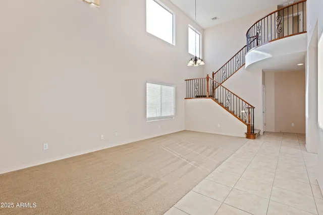 a view of an empty room with stairs