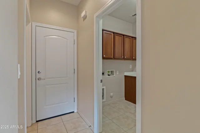 a view of a kitchen from the hallway
