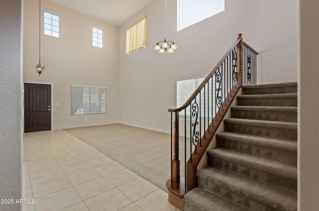 a view of staircase with white walls and stairs