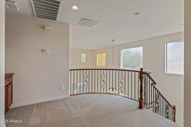 a view of a hallway with windows