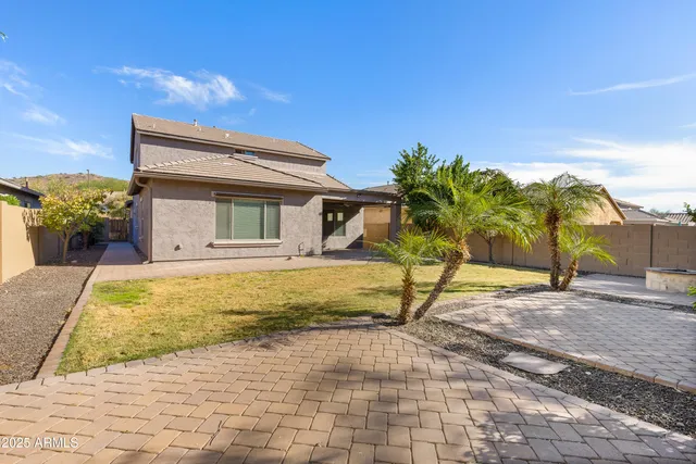 a view of a backyard of the house