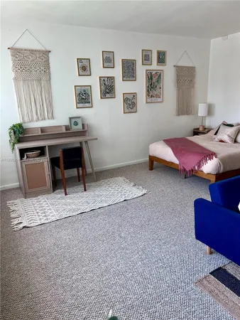 a bedroom with furniture and a bed