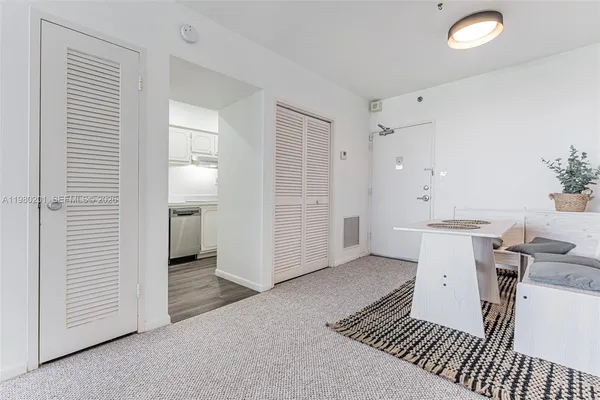 a view of a room with furniture and empty room