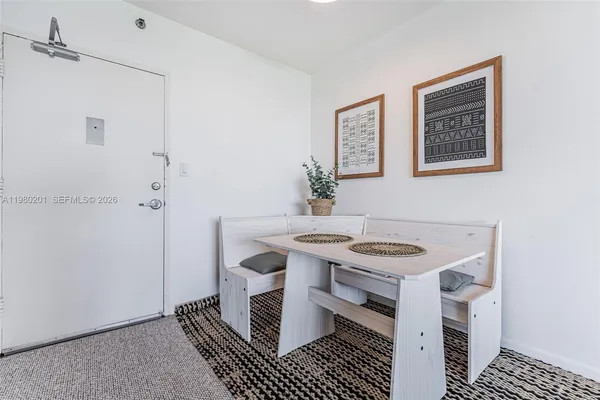 a kitchen with a stove and a refrigerator