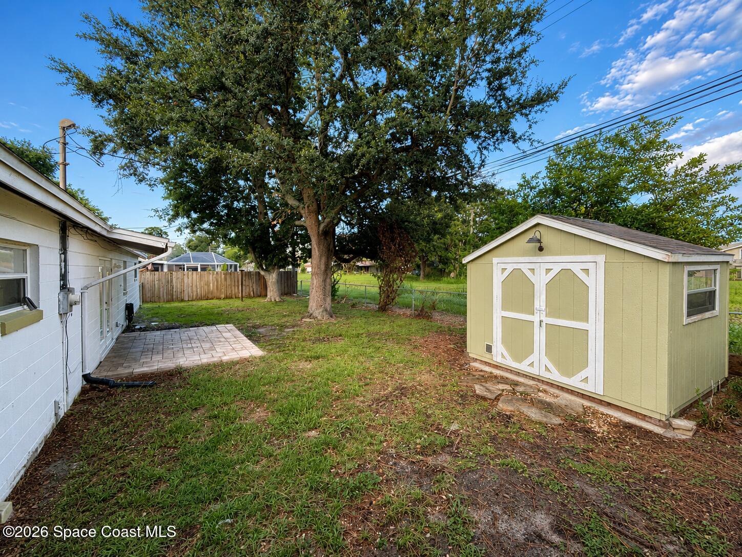 987 Kings Post Road Rockledge, FL 32955 - Photo 8 of 30 a view of a house with a yard and large trees