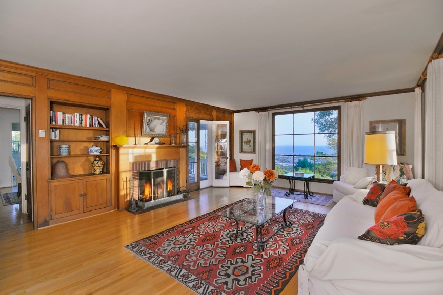 1535 Paterna Road Santa Barbara, CA 93103 - Photo 3 of 20 a living room with furniture a rug and a floor to ceiling window