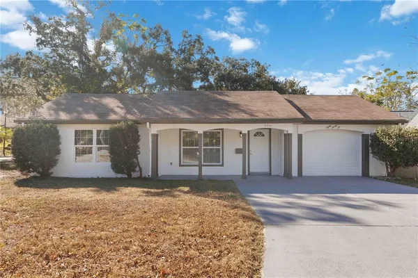 front view of a house with a yard