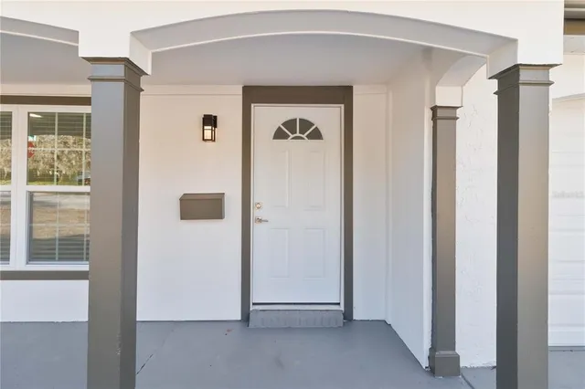 a view of a hallway with front door
