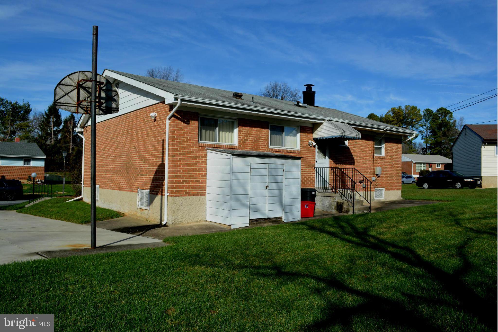 3709 Parkfield Road Baltimore, MD 21244 - Photo 1 of 23 a front view of a house with a yard