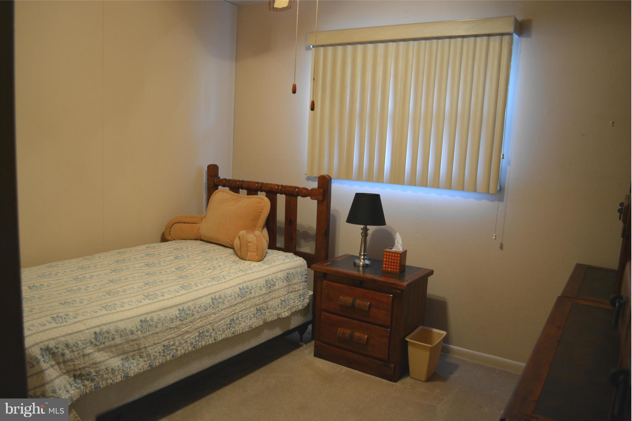 3709 Parkfield Road Baltimore, MD 21244 - Photo 14 of 23 a bedroom with a bed and a window
