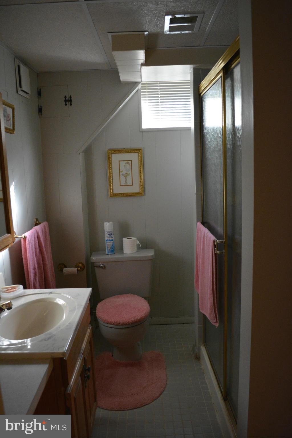 3709 Parkfield Road Baltimore, MD 21244 - Photo 19 of 23 a bathroom with a toilet sink and mirror