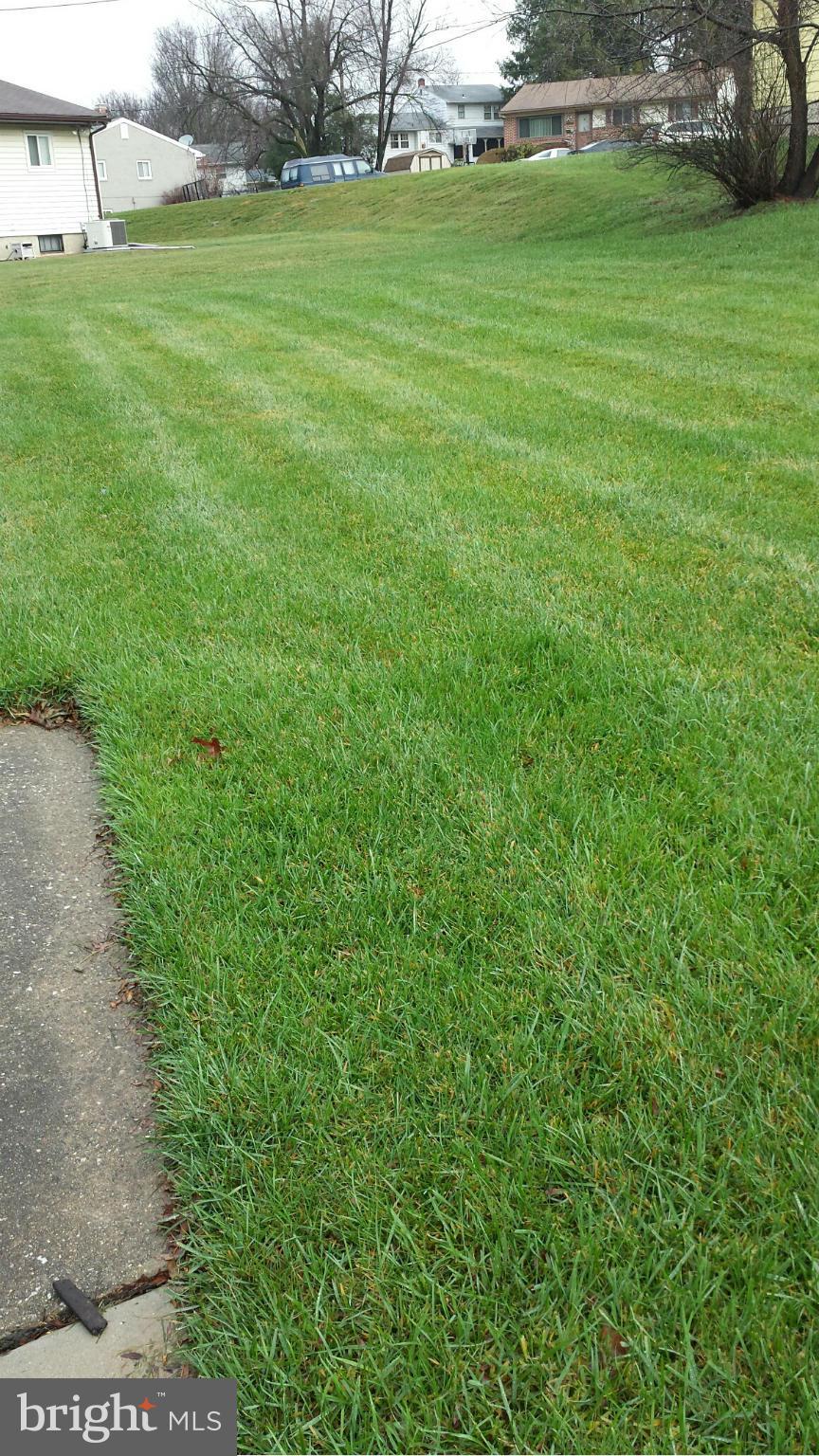 3709 Parkfield Road Baltimore, MD 21244 - Photo 23 of 23 a view of a grassy field with an trees