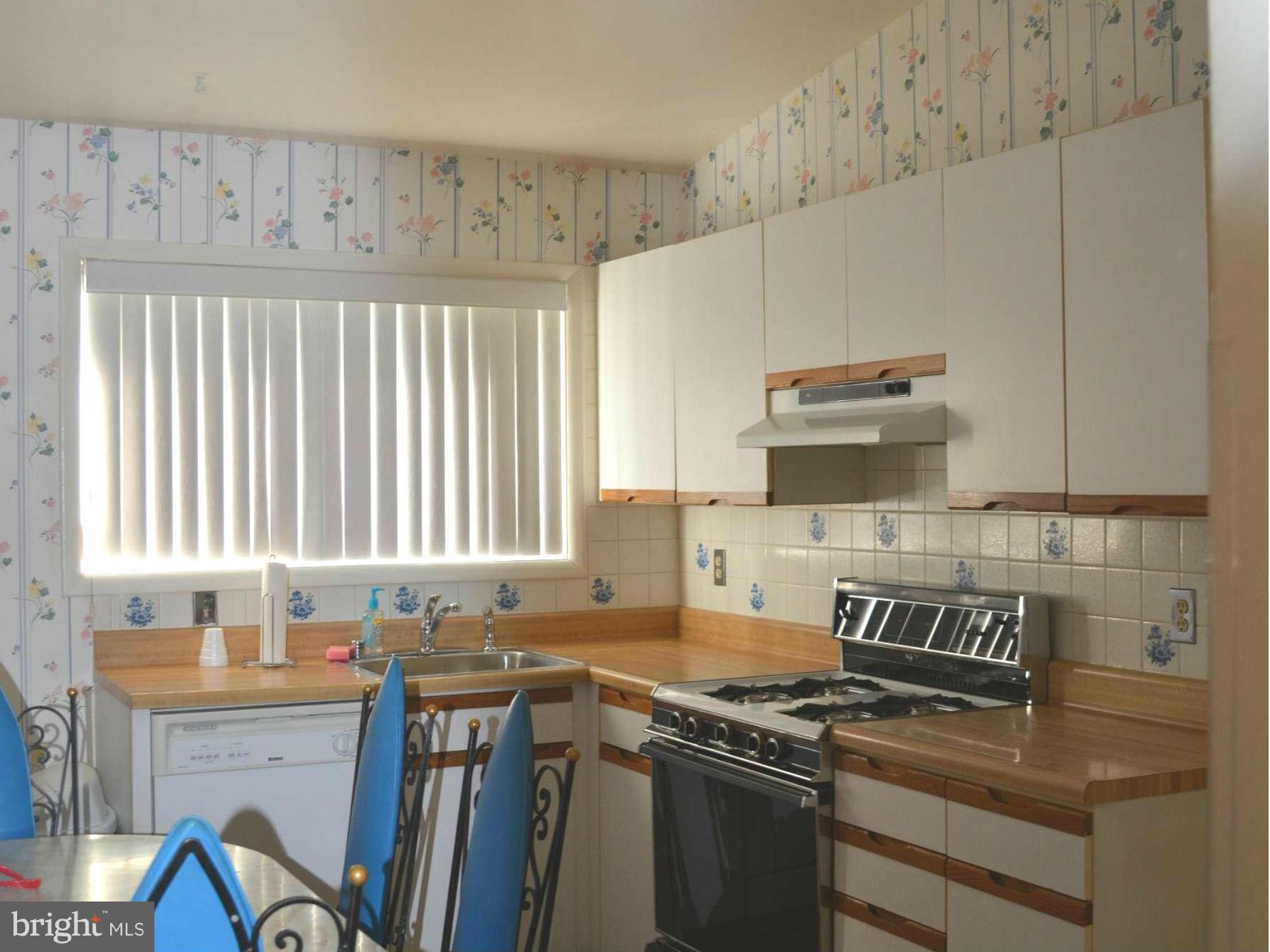 3709 Parkfield Road Baltimore, MD 21244 - Photo 5 of 23 a kitchen with granite countertop a stove a sink and a granite counter tops