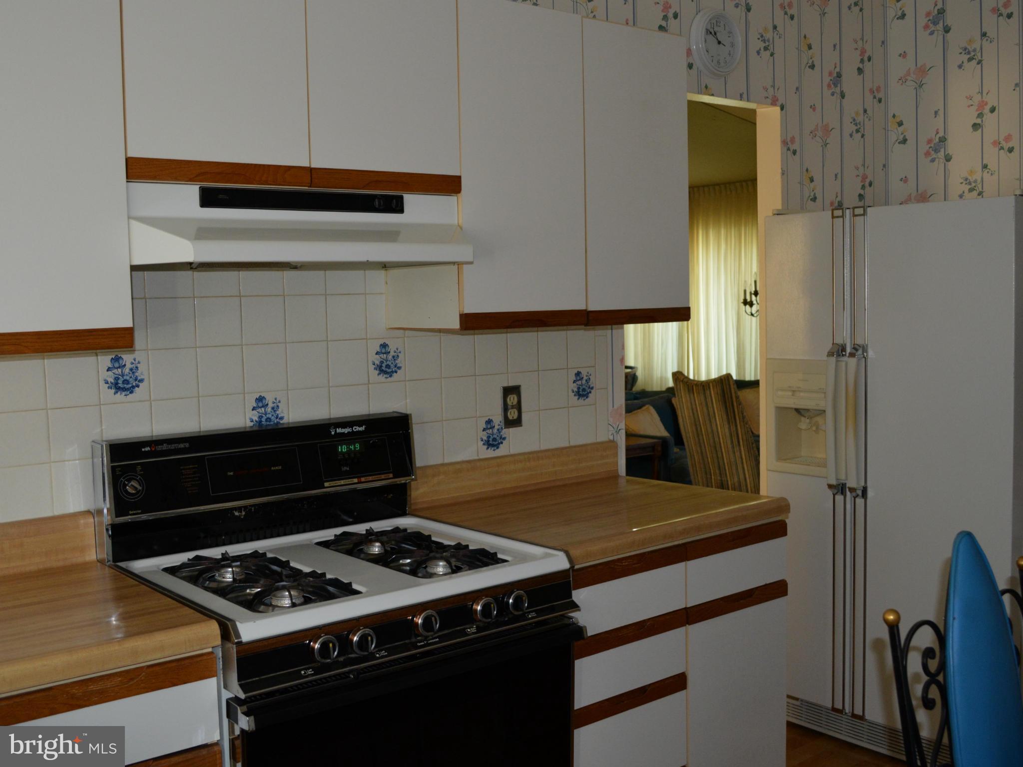 3709 Parkfield Road Baltimore, MD 21244 - Photo 7 of 23 a kitchen with a stove and a refrigerator