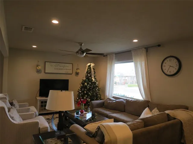 a living room with furniture and a window