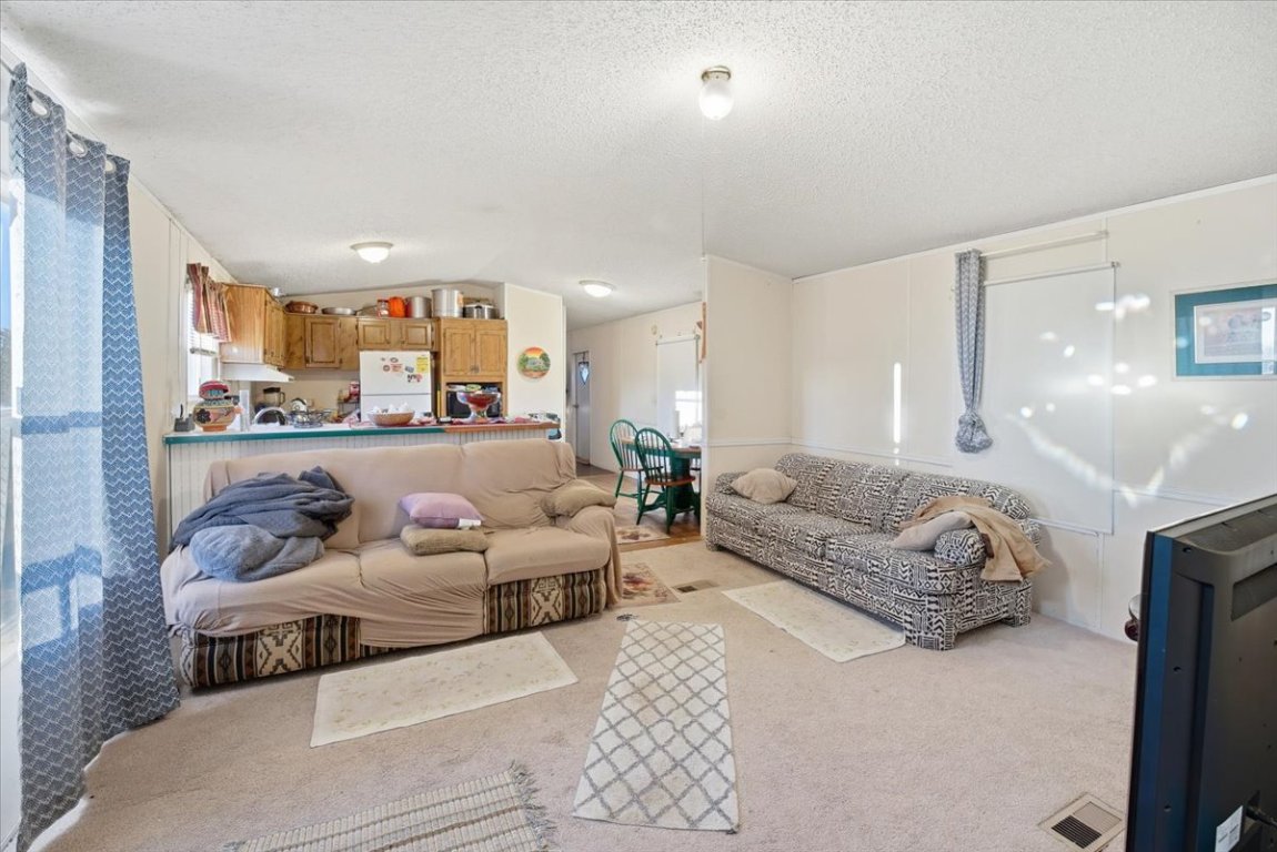 675 Highland Ranch Way Dale, TX 78616 - Photo 11 of 21 a living room with furniture and a couch