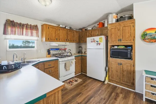 a view of a livingroom with furniture and a flat screen tv