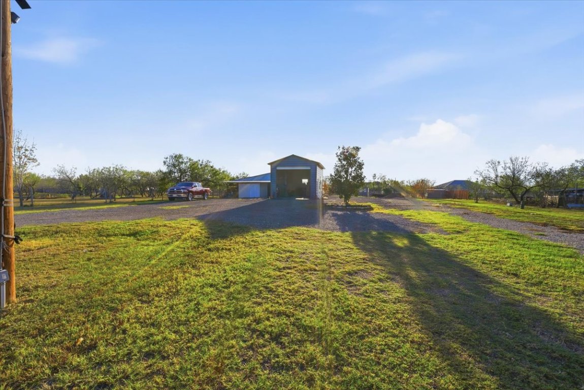 675 Highland Ranch Way Dale, TX 78616 - Photo 9 of 21 a view of a lake with a big yard