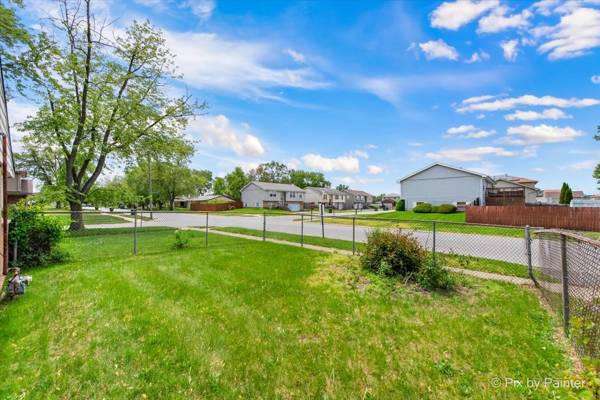 2756 Lancaster Drive Markham, IL 60428 - Photo 4 of 6 a view of a golf course with a lake