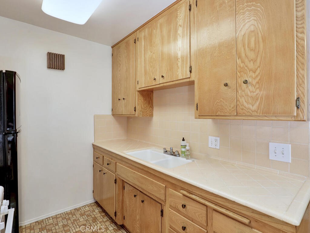 3042 East 3rd Street, Unit 5 Long Beach, CA 90814 - Photo 15 of 25 a bathroom with a sink and a mirror