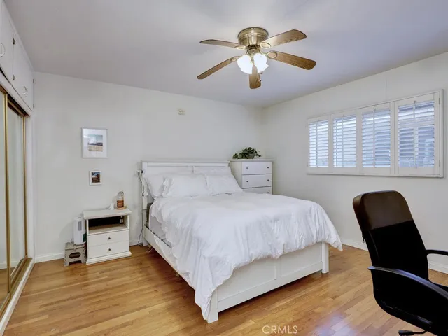 a bedroom with a bed and a chair