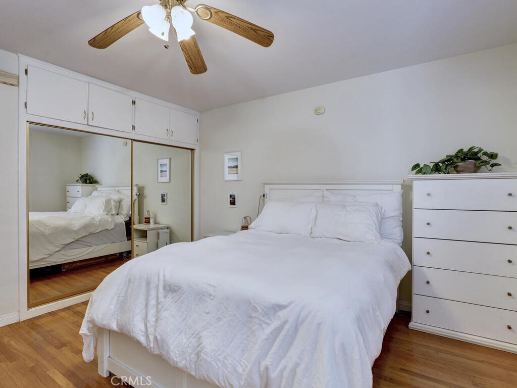 3042 East 3rd Street, Unit 5 Long Beach, CA 90814 - Photo 22 of 25 a bedroom with a bed and a dresser