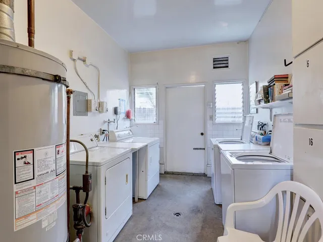 a kitchen with cabinets a sink and appliances