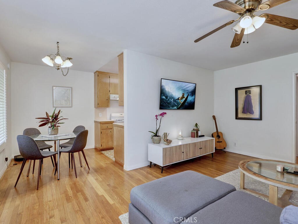 3042 East 3rd Street, Unit 5 Long Beach, CA 90814 - Photo 10 of 25 a living room with furniture and a flat screen tv