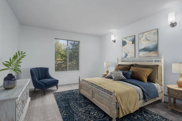 a bedroom with a bed and a couch