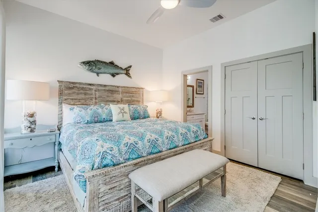 a bedroom with a bed and a dresser